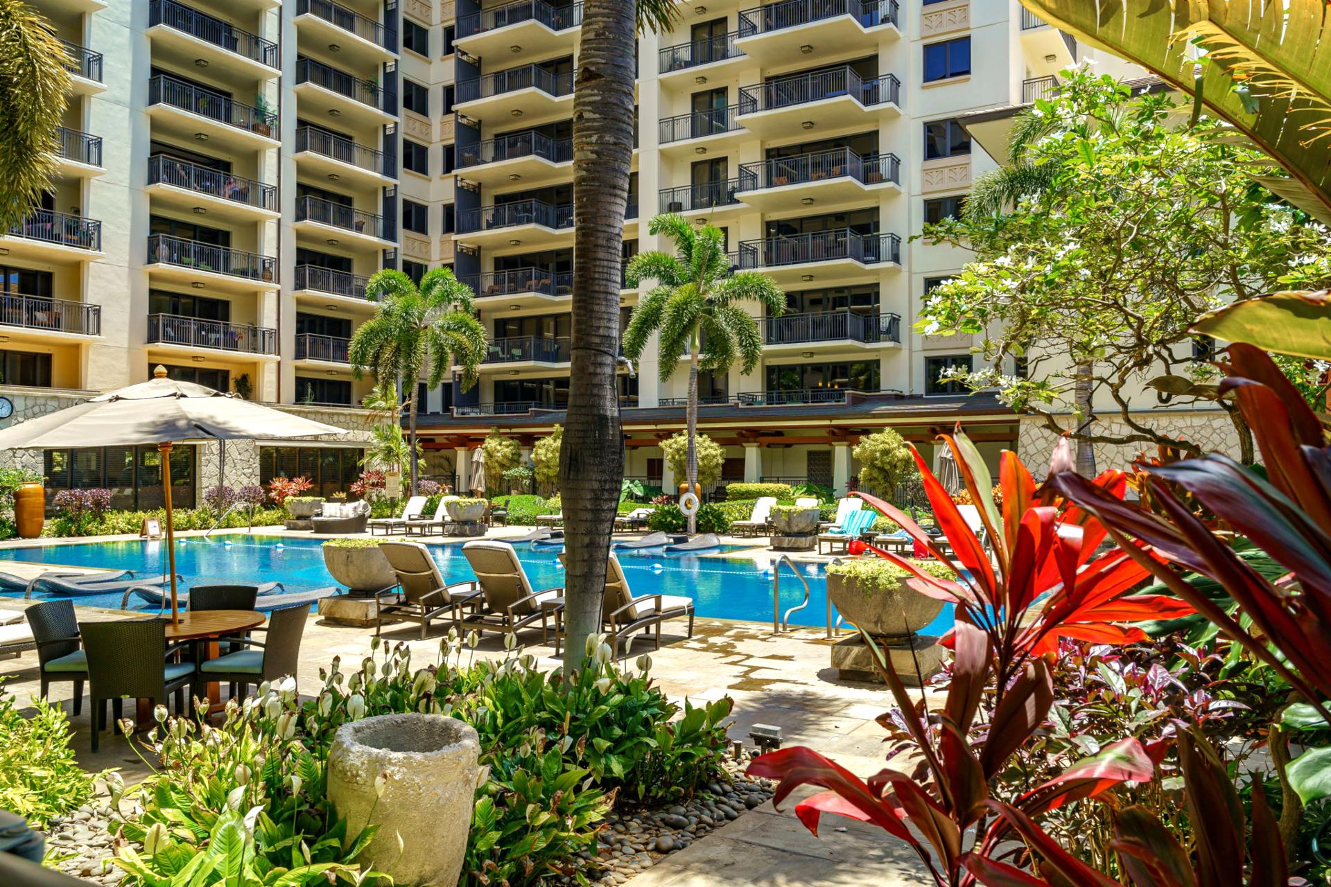 Surrounded by vibrant flora, the pool area is an oasis of tranquility and beauty. Cool off, relax, and soak in the island vibe.
