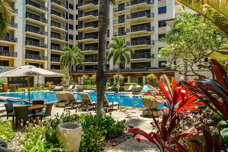 Surrounded by vibrant flora, the pool area is an oasis of tranquility and beauty. Cool off, relax, and soak in the island vibe.