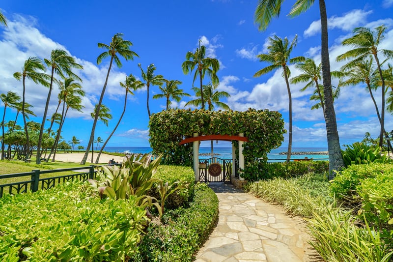 Lush gardens and swaying palms surround every corner of Beach Villas. The outdoor spaces here are designed for peaceful island living.