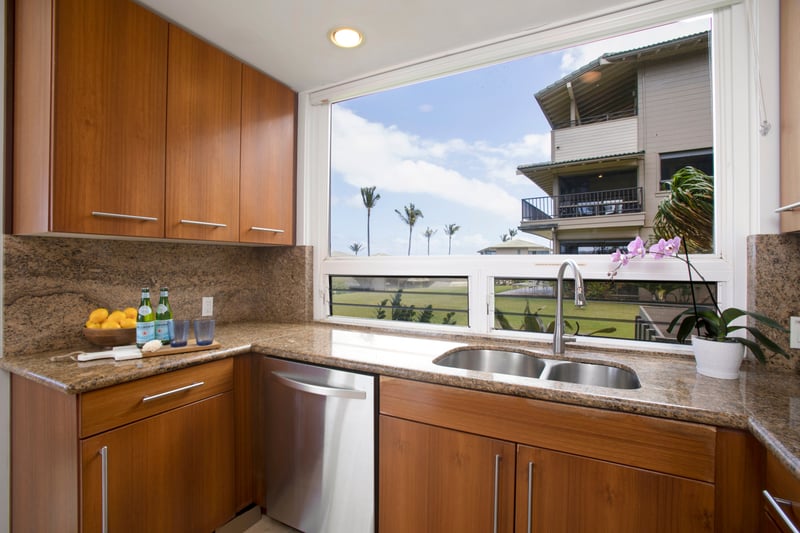 Stainless steel meets tropical feel—this kitchen is ready for your next recipe or a lazy snack break with a breeze