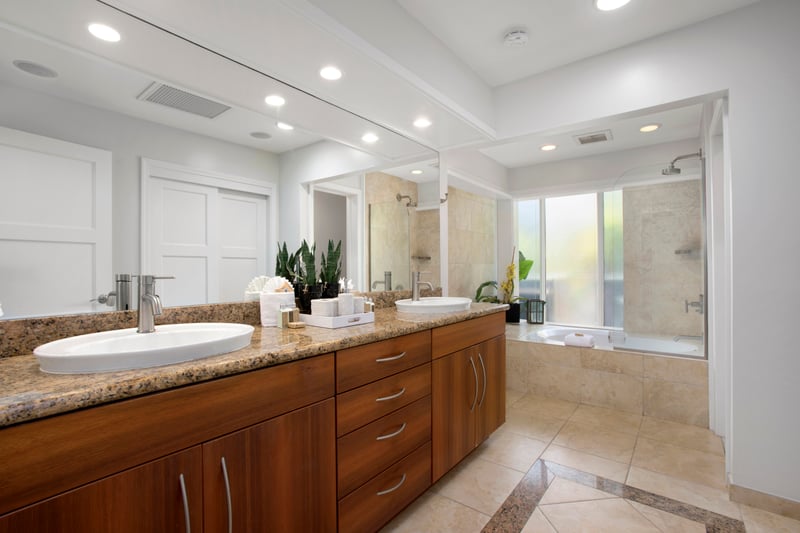 Where granite meets glam—this master bath blends modern elegance with just the right dose of tropical relaxatio