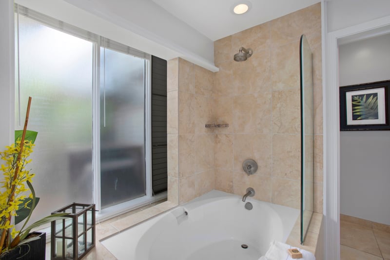 Sleek, spacious, and oh-so-inviting—this bath brings the bubbles, the brightness, and the perfect spot to soak and unwind