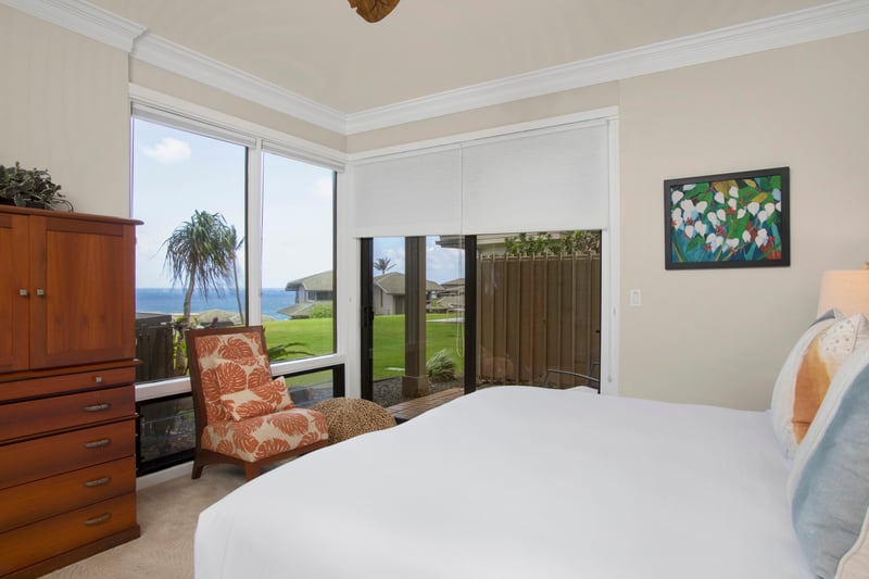 Bright pillows, beachy breeze, and your own chill zone—this guestroom makes checking in way better than checking ou