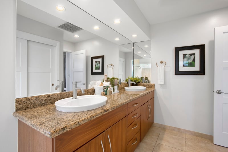 Get ready in style with double vanities, sleek lighting, and a spa tub that’s calling your name for a splash of vacation luxury