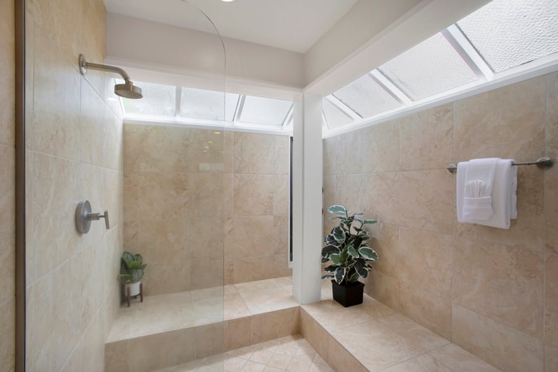 Step into your own personal spa—complete with marble tones, natural light, and the tub of your dreams. Robes optional!