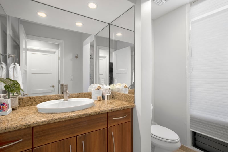 A little luxury goes a long way—this bright guest bath delivers spa-style shine and thoughtful touches in every corner