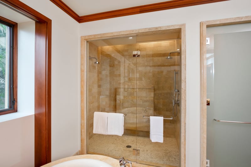 In your Master Bath, a walk in shower and deep soaking tub are complemented by dual vanities and warm wood cabinetry. MON-2204