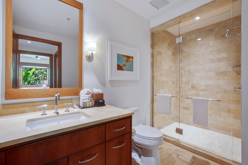 Modern art meets golden tile in this chic corner, a space where style and comfort dance effortlessly
