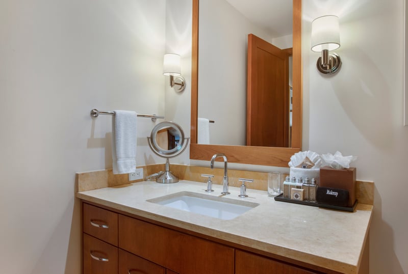 This guest bath balances charm and polish, like a well-dressed host offering champagne and a warm smile