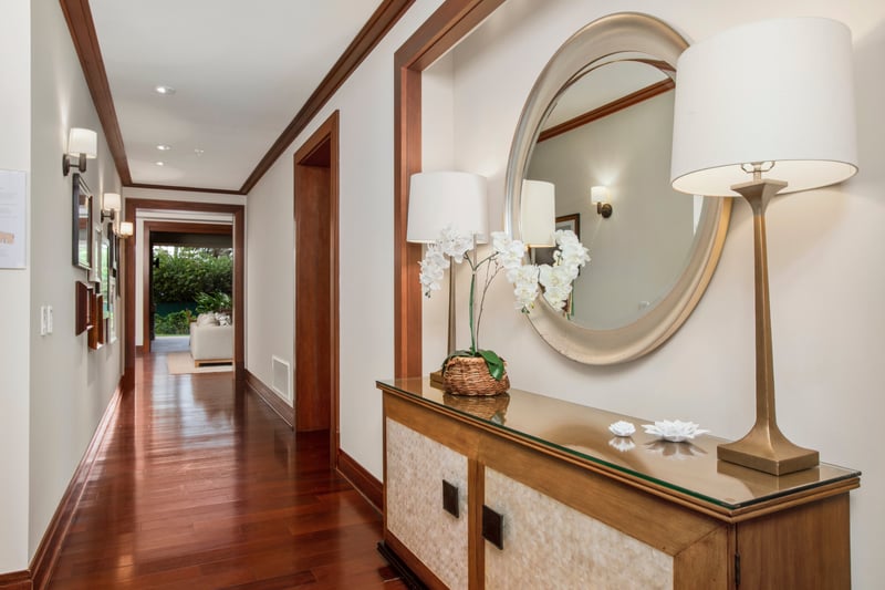 Step into serenity—this charming entryway sets the tone with soft lighting, fresh blooms, and a welcoming glow MON-2204