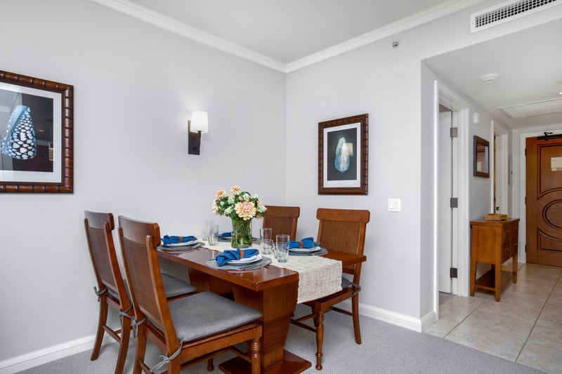 Charming dining nook with coastal accents and inviting floral centerpiece. HKK-220