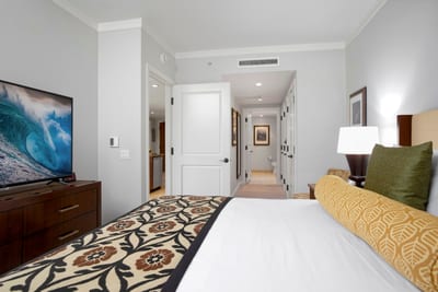 Inviting bedroom escape with cozy touches and ensuite hallway access. HKK-220
