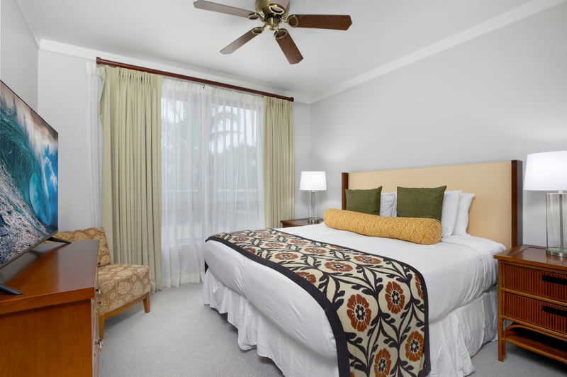 Peaceful island bedroom with tropical patterns and soft natural light. HKK-220