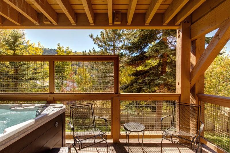 Enjoy morning coffee or evening stargazing from your mountain-view balcony with seating and private hot tub access.