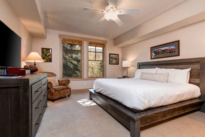Rest easy in the spacious primary suite with a King bed, Smart TV, and ensuite bath for added privacy. TPC-102C