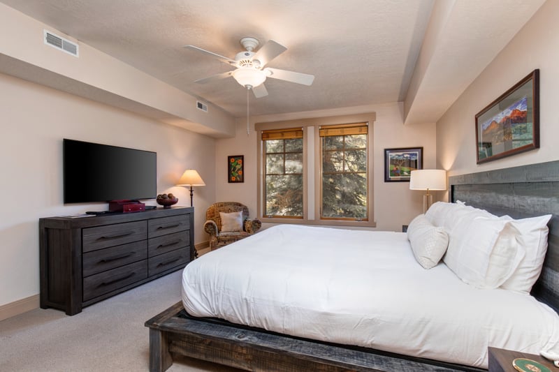 Wake up to forest views in your spacious primary suite with a King bed and Smart TV for winding down.