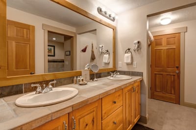 Refresh in your ensuite with a wide granite vanity, warm-toned finishes, and ample lighting to start your day. TPC-102C