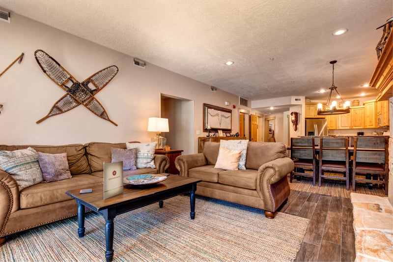 Relax in the inviting great room with lodge-inspired furnishings, rustic wall décor, and seamless connection to the kitchen.