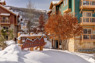 A picturesque snow-covered entry at The Park Club, with easy access to the slopes and trails nearby. TPC-102C
