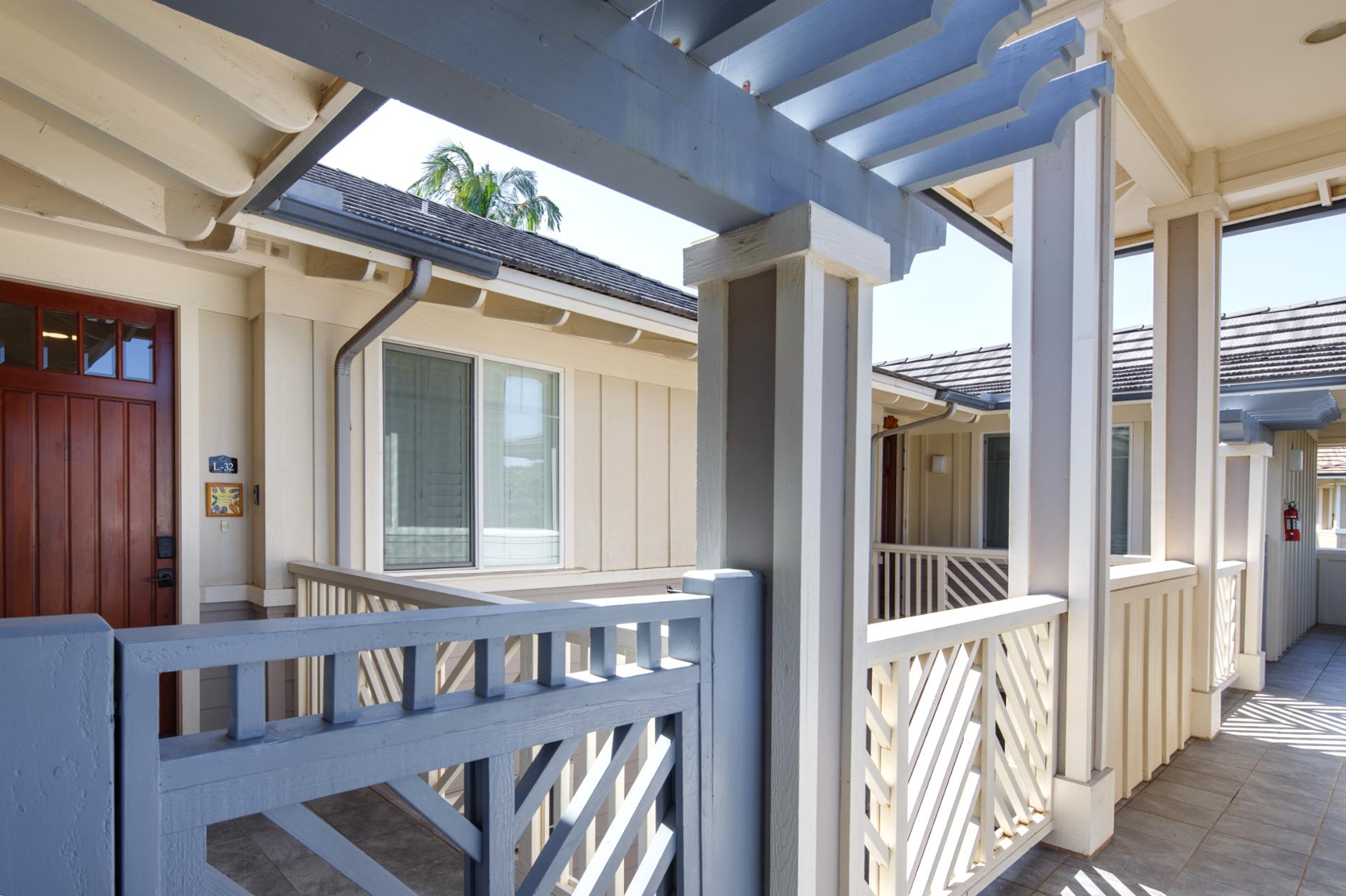 Covered entry with seating and tropical views, welcoming you home after exploring the island.