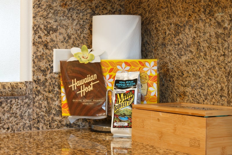 Granite counters and tropical touches create a warm, functional space for island-style cooking.