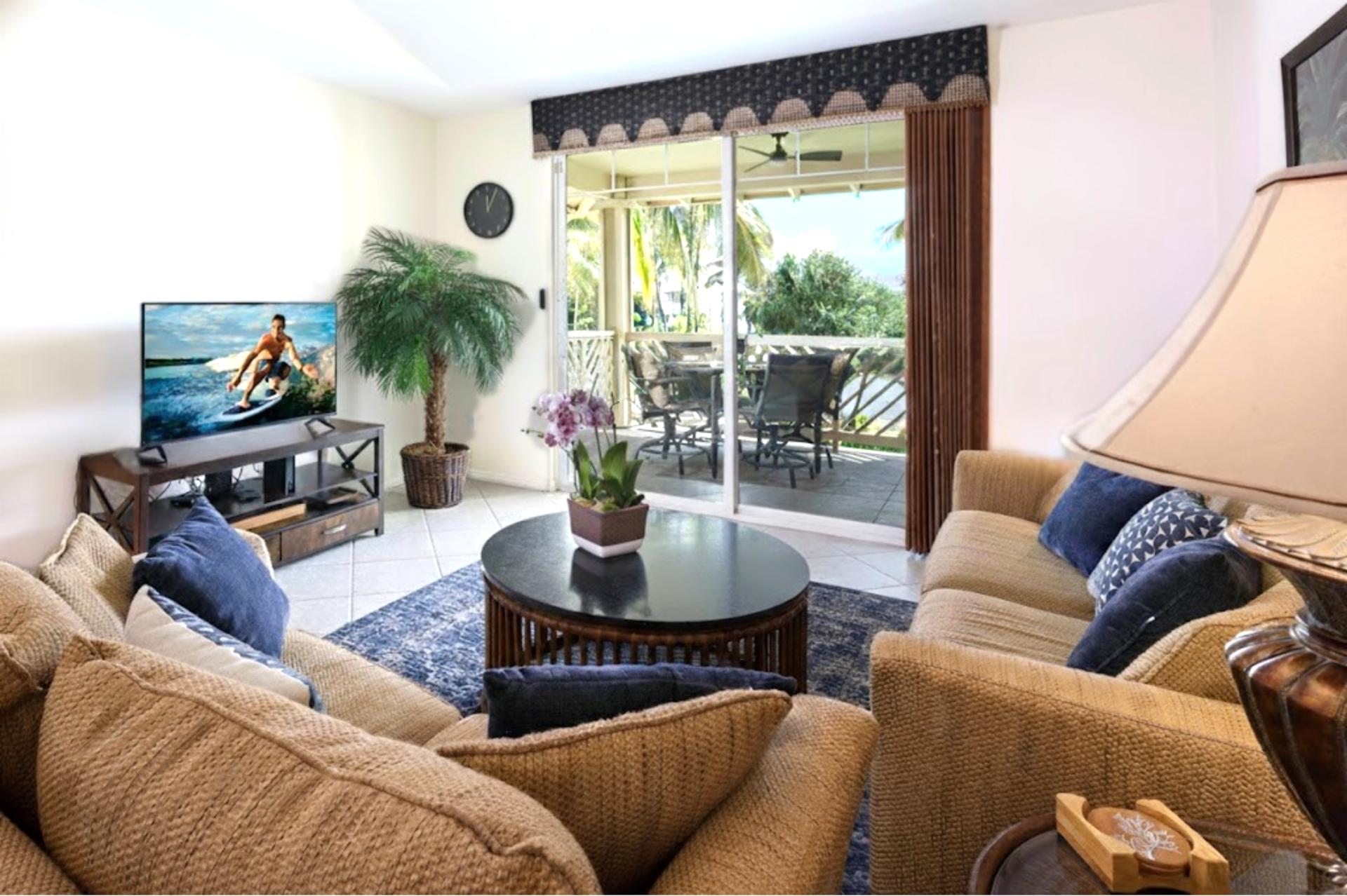Spacious living area with sofa sleeper and Smart TV, perfect for family movie nights after the beach.