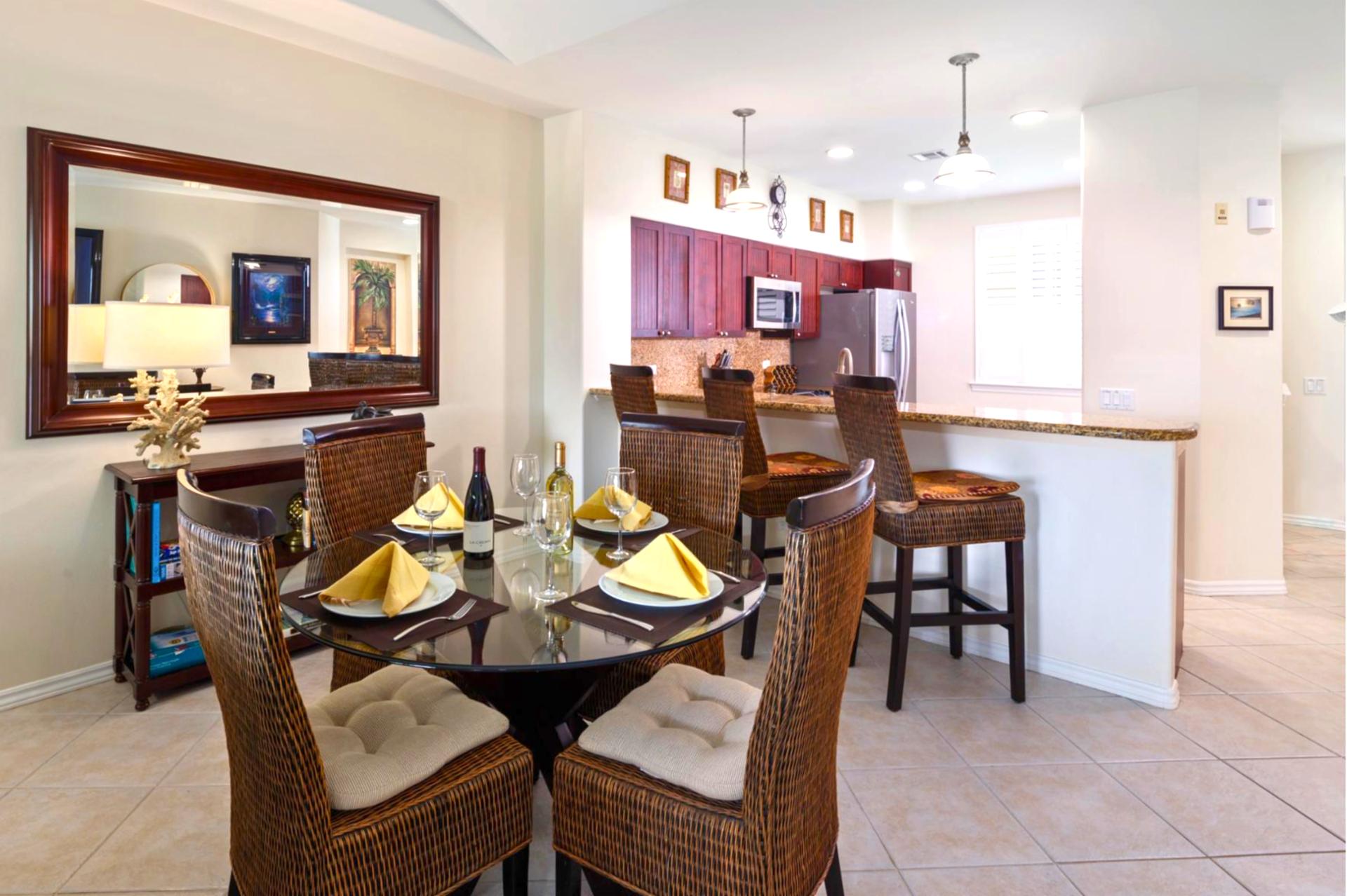 A full dining table with seating for 4 anchors the space for shared meals or evening board games.