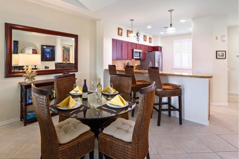 A full dining table with seating for 4 anchors the space for shared meals or evening board games.