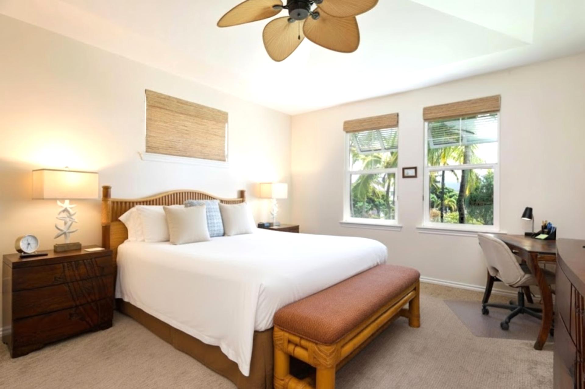 Primary bedroom with King bed, Smart TV, and ceiling fan for cool, restful nights.