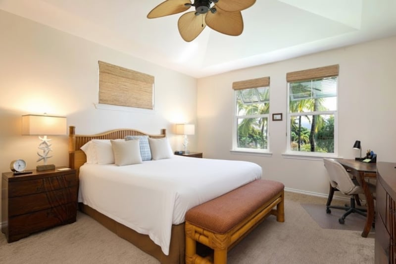 Primary bedroom with King bed, Smart TV, and ceiling fan for cool, restful nights.