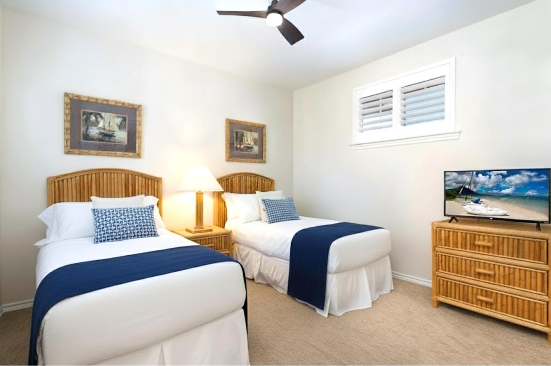 Guest room with two Twin beds and Smart TV, great for kids or friends traveling together.