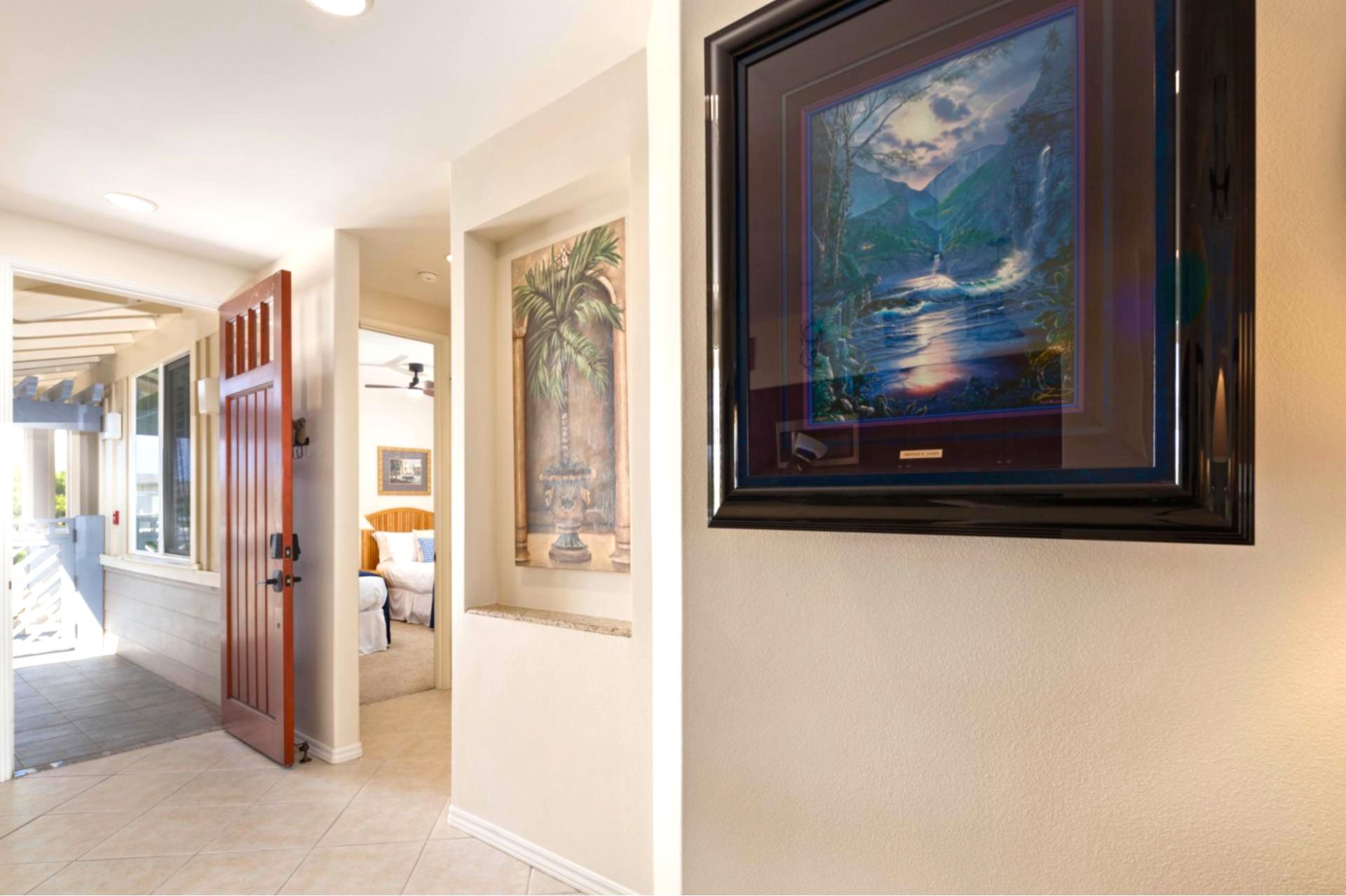 Hallway artwork and finishes add a welcoming touch as you return from your island adventures.