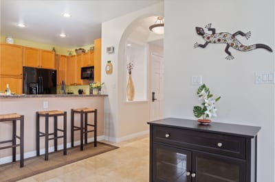 Open kitchen with arched details and a breezy breakfast bar