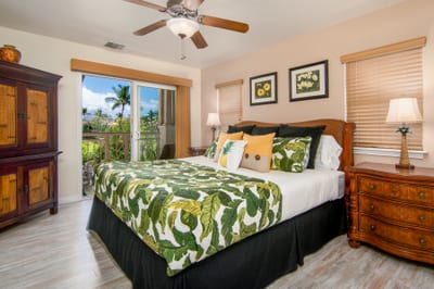 Spacious master suite with tropical bedding and private lanai access
