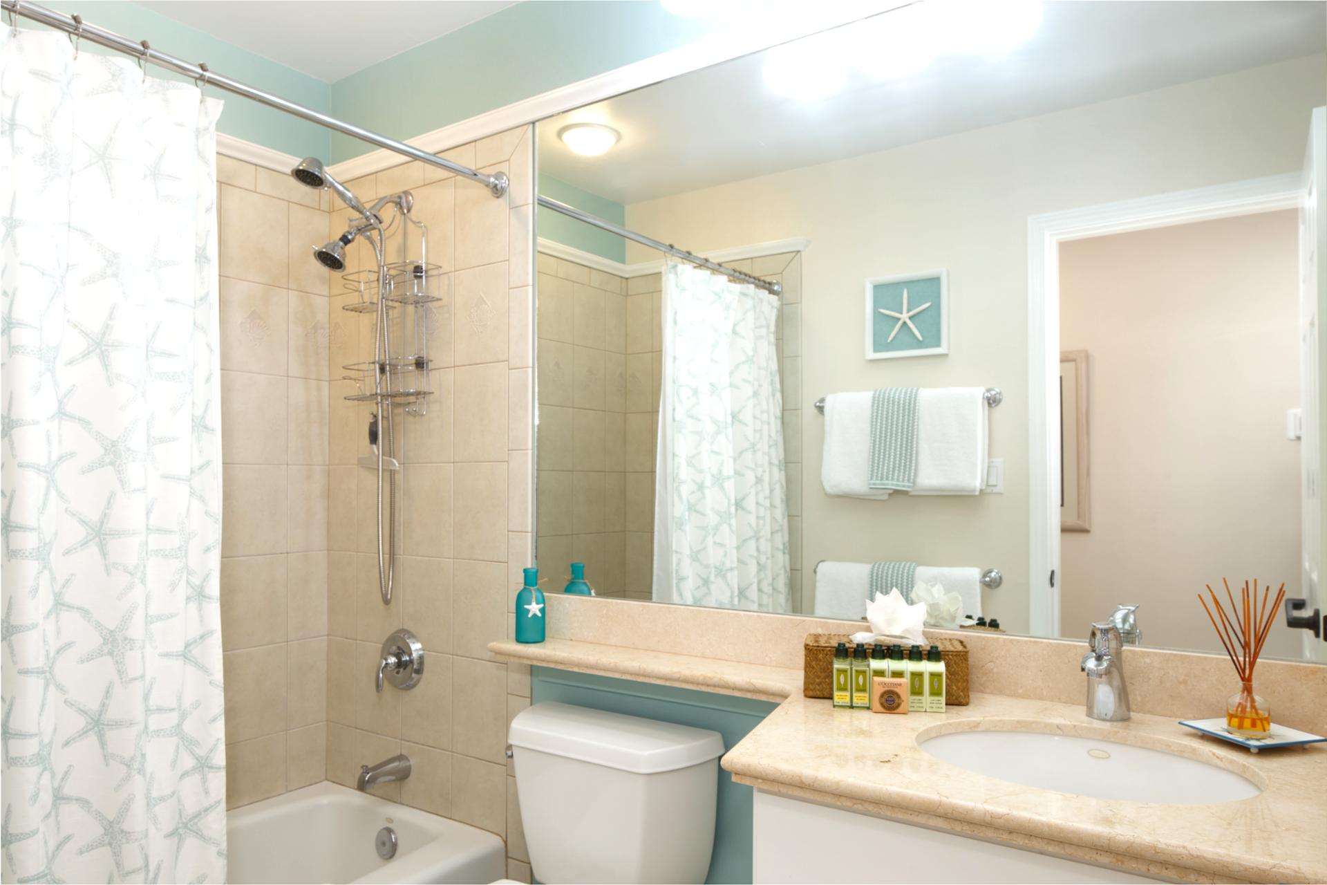 Updated guest bathroom with tiled shower and soft lighting