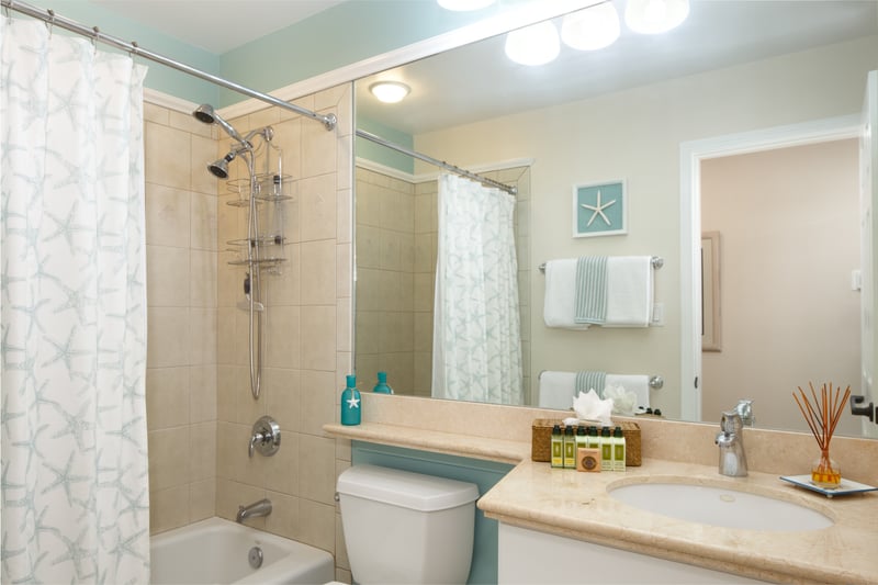 Updated guest bathroom with tiled shower and soft lighting