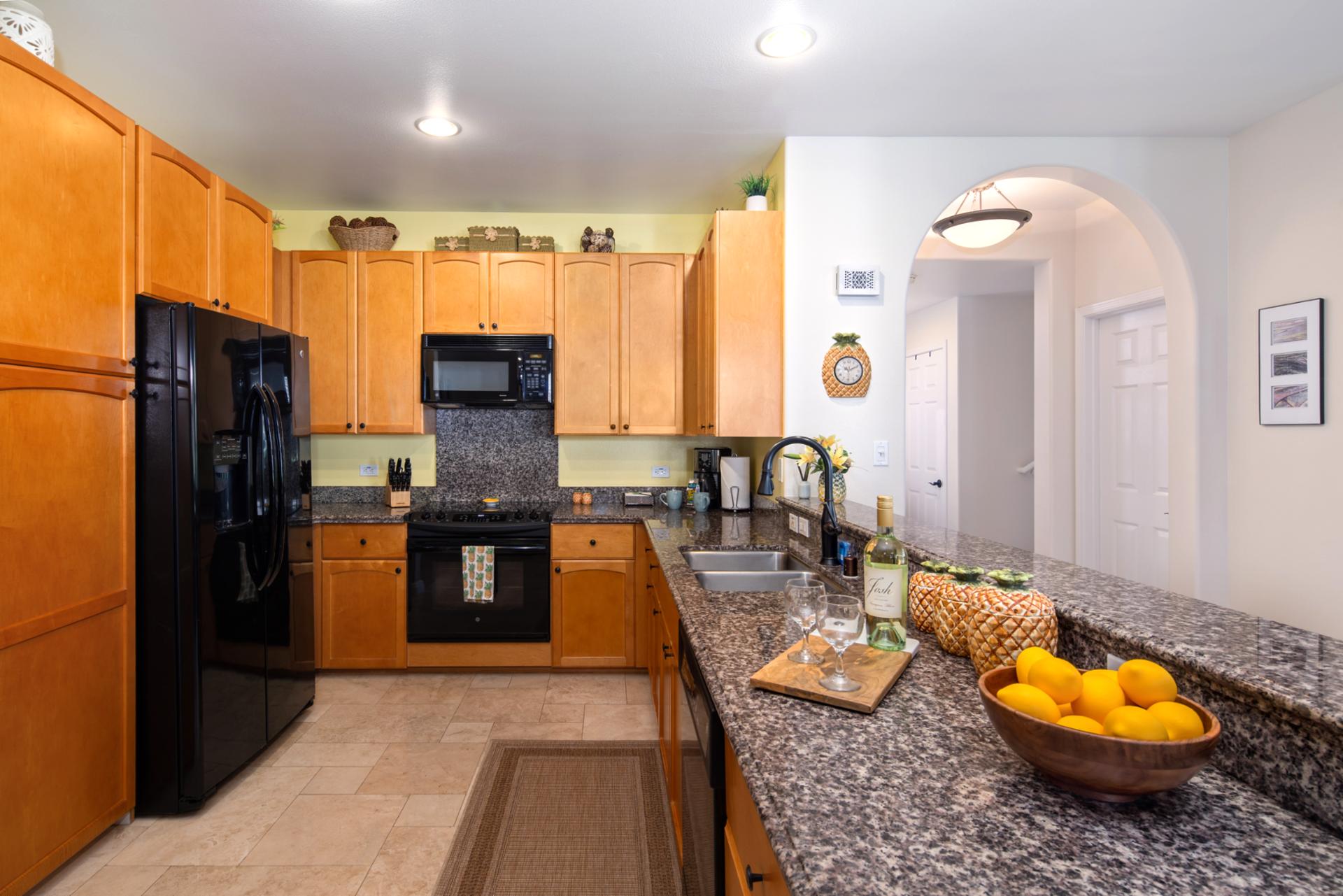Fully equipped kitchen with warm wood cabinetry and plenty of space