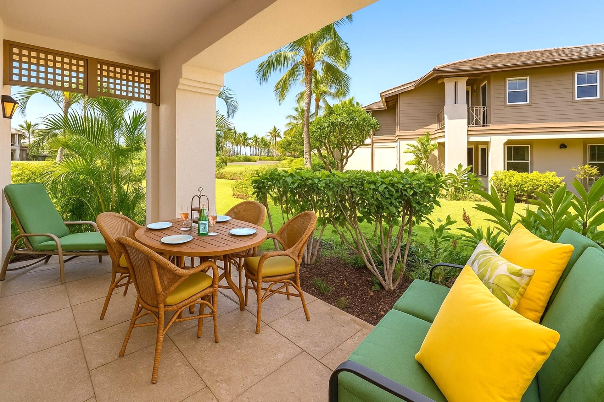 Lounge in tropical comfort on this shaded lanai with lush garden views