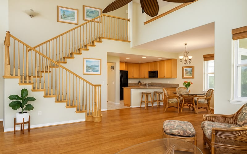 Beautiful hardwood floors and staircase elevate the warmth of this island getaway