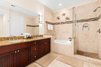 Spa-like primary bathroom complete with a double vanity and a spacious walk-in shower and soaking tub FVW-L21