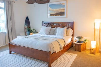 Relaxing primary suite with a king size bed and warm, island inspired decor FVW-L21
