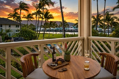 Covered lanai perfect for outdoor dining, featuring ocean views in the distance FVW-L21