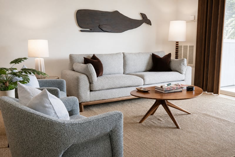 The living room offers comfortable seating and easy access to the lanai through large sliding glass doors FVW-L21