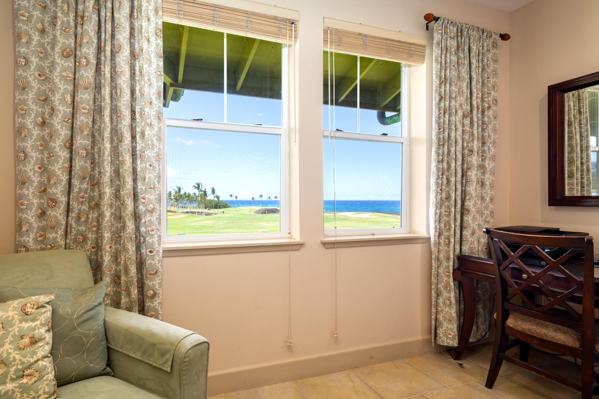 Enjoy the view from bed or your cozy reading chair in this sun-filled suite