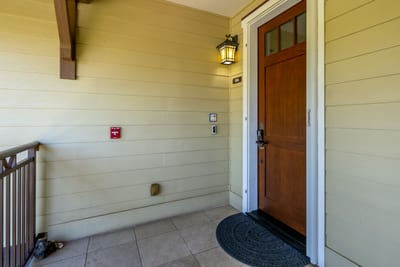 Welcoming entryway with keypad lock, lantern light, and unit 12A. HLI-12A