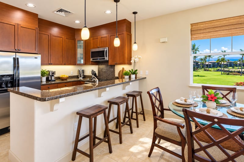 Your fully equipped kitchen offers counter seating and views toward the Kohala Coast, keeping meal prep connected to the scenery. HLI-12A