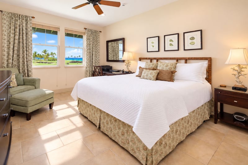 Your primary bedroom pairs a king bed with golf course and ocean views, bringing the Kohala Coast scenery right to your window. HLI-12A