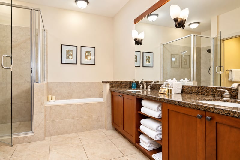 Your primary bathroom includes a vanity, a tub, and a separate shower, along with complimentary LAFORRÉ bath and body amenities. HLI-12A