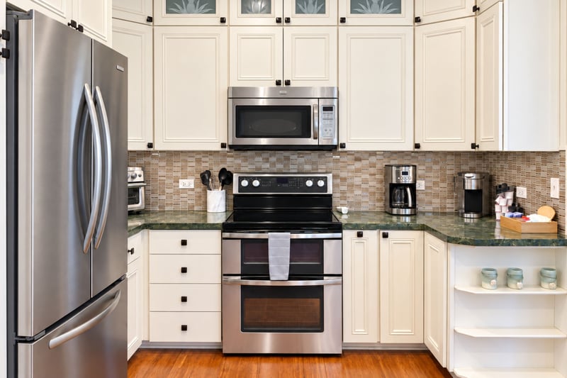 Double oven range centers the cooking area, with a coffee maker, toaster oven, and single-serve coffee station within reach.