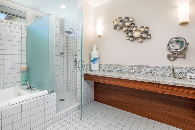Modern guest bathroom featuring a spacious walk-in glass shower.